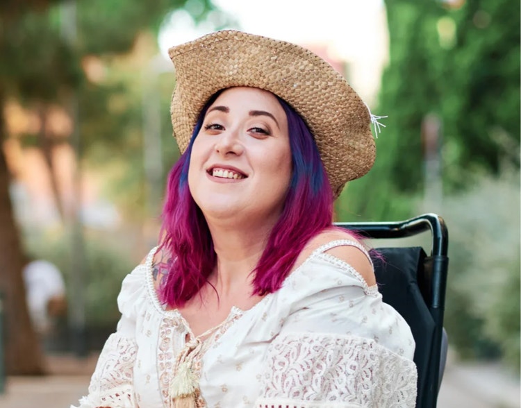 A woman in a chair smiling