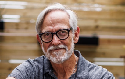 An older male cancer patient smiling