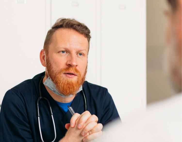 A doctor explaining something to a patient