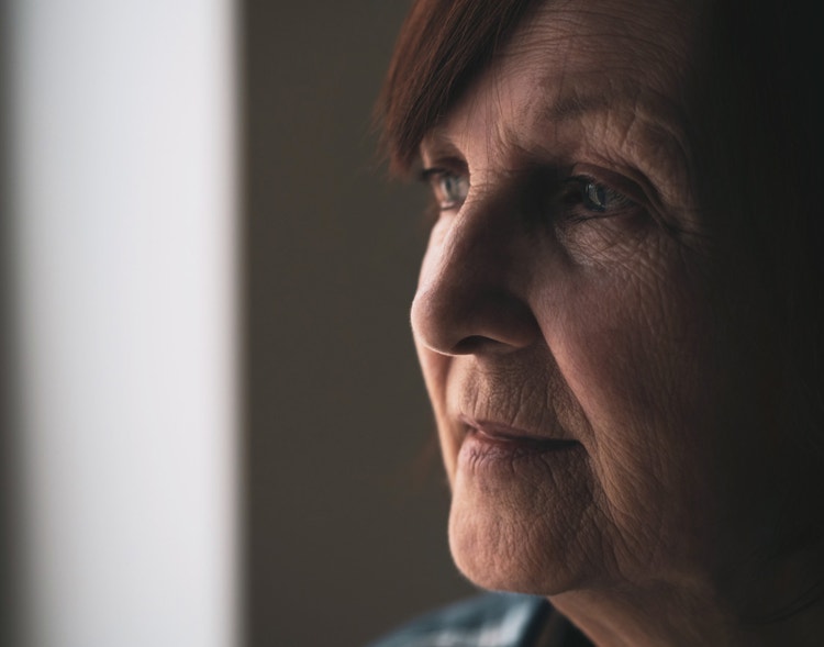 A woman looking out of a window