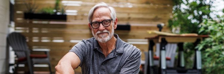 An older male cancer patient smiling