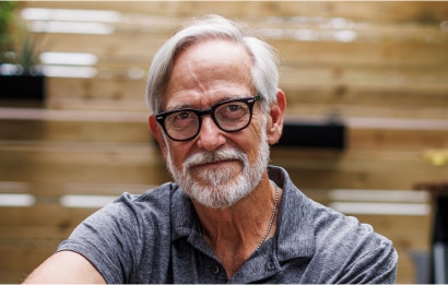 An older male cancer patient smiling