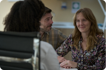 Actor portrayal of a patient and family member speaking with a healthcare professional