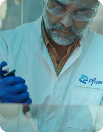 Actor portrayal of a scientist using a pipette in a laboratory mobile