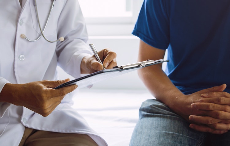 A man and his doctor discussing a prostate cancer screening