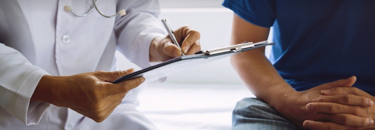 A man and his doctor discussing a prostate cancer screening